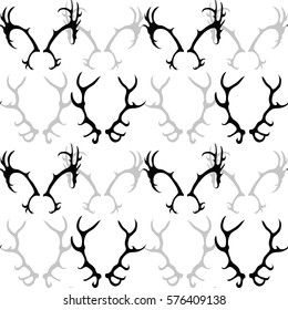 Seamless black and white pattern with silhouette of deer horns. Vector texture for your creativity
