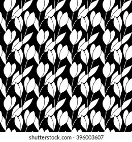 Seamless black and white pattern with silhouettes of snowdrops on a black background. Vector eps 10.