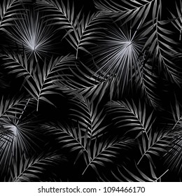Seamless black white pattern with tropical palm leaves. Black background. Vector seamless pattern. Tropical illustration. Jungle foliage.