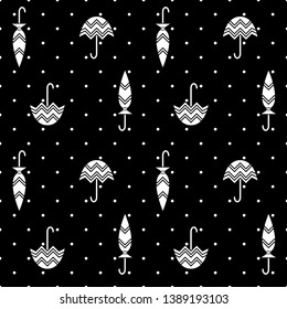 Seamless black and white pattern with umbrellas and polka dots. 