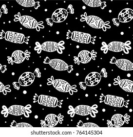 Seamless black and white texture with cartoon festive candies of various shapes. Vector pattern for your creativity