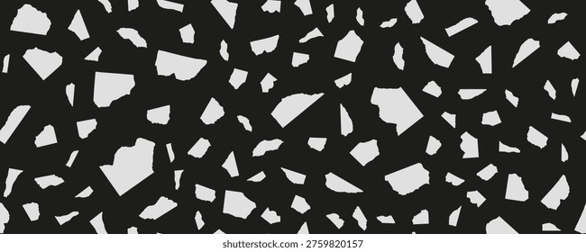 Seamless black and white torn paper pattern with irregular abstract shapes scattered randomly on dark background. Abstract collage texture scrap fragment paper.