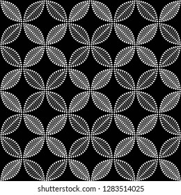 Seamless black and white trellis pattern of dotted leaves and flowers with intersections. Lace petals. Vector Illustration.
