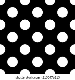 Seamless black and white vector polka dot pattern.