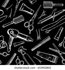 Seamless black-and-white pattern with hairdressers tools. Vector illustration in vintage engraved style on black background.  