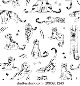 Seamless black-white pattern with cute tigers, scratches and paw marks. Design for fabric and wrapping paper with tiger - symbol of 2022 new year.