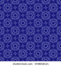 Seamless blue abstract pattern on a blue background imitating a stylized lace pattern