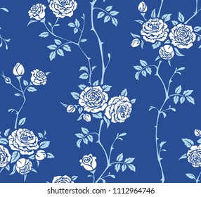 Seamless blue background with branches of white roses. Vector floral pattern for wallpaper, fabric, gift wrap, digital paper, fills, etc.