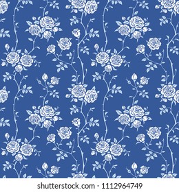 Seamless blue background with branches of white roses. Vector floral pattern for wallpaper, fabric, gift wrap, digital paper, fills, etc. Shabby chic style.