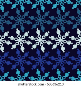 Seamless blue background with decorative snowflakes. Scribble texture. Textile rapport.