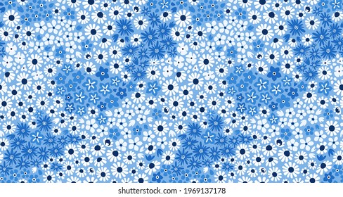 Seamless blue background with small wildflowers. Ornamental floral pattern for fabric, wallpaper, digital paper, fills, etc.