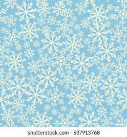 Seamless blue background with snowflakes. Pattern snowfall. Vector illustration