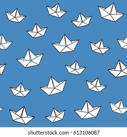 Seamless blue background with white boats. Origami style.