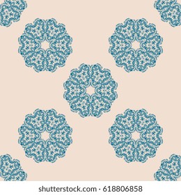 Seamless blue ornament on background. Wallpaper pattern