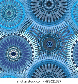 Seamless blue pattern with oriental mandalas. Islam, Arabic, Asian motifs. Kaleidoscope print. Vintage lace mood. Fabric, wallpaper or wrapping