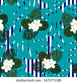 Seamless blue striped vector tropical pattern. Plumeria, frangipani. Exotic vector beach wallpaper seamless pattern.