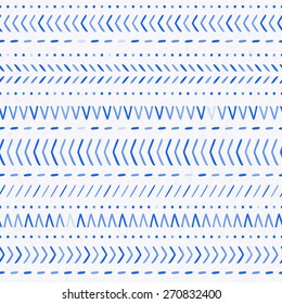 seamless blue tribal ethnic pattern on a watercolor paper background