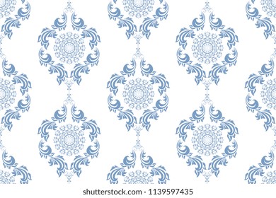 Seamless blue wallpaper pattern. Seamless ornament on background. Floral ornament on background.  Seamless pattern for your design. Textile pattern. Wallpaper pattern