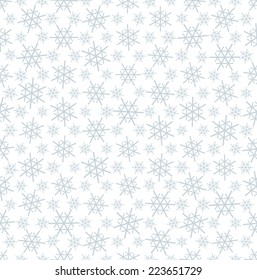seamless blue and white colored snowflake background