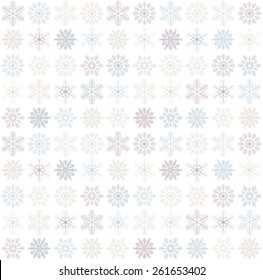 seamless blue and white colored snowflake background
