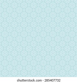 seamless blue and white colored snowflake background
