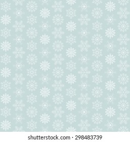 seamless blue and white colored snowflake background