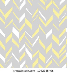 Seamless Boho Chevron. Hand drawn imperfect stripes in pale yellow and light to medium grey. Hot summer fashion trendy pattern.