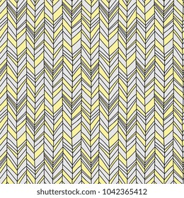 Seamless Boho Chevron. Hand drawn imperfect stripes in pale yellow and light to medium grey. Hot summer fashion trendy pattern.