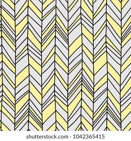 Seamless Boho Chevron. Hand drawn imperfect stripes in pale yellow and light to medium grey. Hot summer fashion trendy pattern.