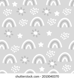 Seamless boho pattern with rainbows, stars, rain and sun for textiles and fabrics. Scandinavian print. Summer wallpaper, background