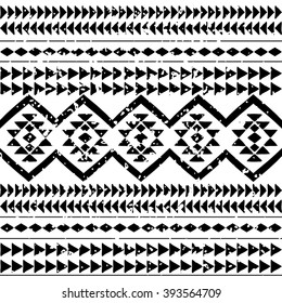 Seamless boho style pattern with tribal aztec motives. Abstract wallpaper with grunge effect. Black and white.