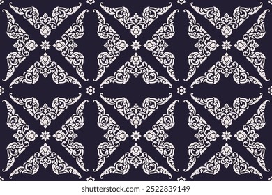 Seamless bold white colored traditional Thai art floral arabesque pattern in damask style motifs suitable for wallpaper, curtain, clothing, textiles and fabric design isolated over navy background.