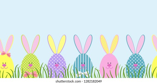 Seamless border with Easter bunnies in the green grass. Decorative Easter bunnies. Vector illustration