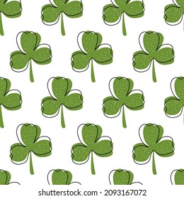 Seamless botanical pattern with clover leaves for St. Patrick's Day, Irish holiday. Green primitive shamrocks on a white background for printing on fabric, wallpaper, paper, curtains, tablecloths.