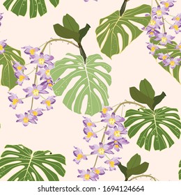 Seamless bright artistic tropical pattern with palm leaves, philodendron leaf, monstera, violet orchid flower. Modern colorful background.