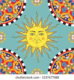 Seamless bright background. Colorful ethnic round ornamental mandala. Sun with human face symbol. Trendy pattern. Vector illustration