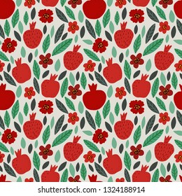 Seamless bright colorful floral pattern of pomegranates, flowers and leaves on beige background. Perfect for textile, manufacturing, fabric etc. Vector illustration