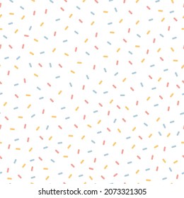 Seamless Bright confetti vector party pattern. Colorful sugar sprinkle design on a white background.