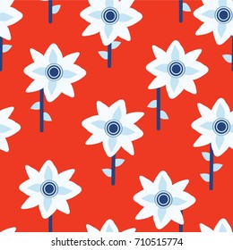 A seamless bright pattern of white flowers with dark blue centers on a red background. Would be suitable for cards, wallpaper, wrapping paper, banner designs, interior decor.
