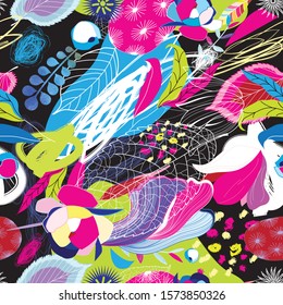 Seamless bright tropical pattern of leaves, spots and flowers on dark background. Design template for Wallpaper, fabric or web pages. Advertising vacation in the tropics.