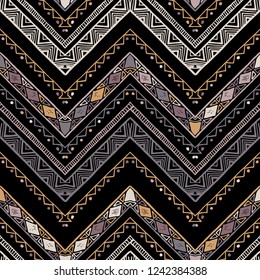 Seamless bronze metallic ethnic zigzag chevron pattern. Hand drawn colorful geometric background. Striped tribal motifs. Vector illustration