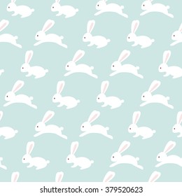 Seamless bunny pattern on blue background