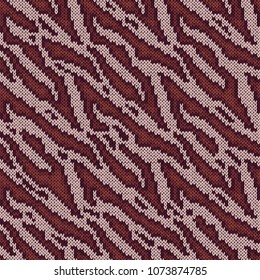 Seamless camouflage background, knitting vector pattern as a fabric texture in various magenta and terracotta hues