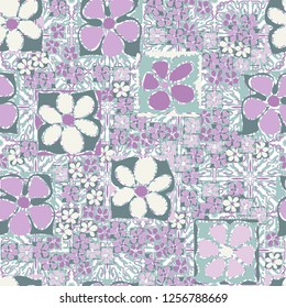 Seamless camouflage pattern. Abstract composition of square flowers located on the background of the ornament and square splashes.