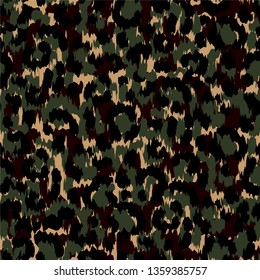 Seamless camouflage pattern with classic green, brown and black spots on tan background. Texture military, army, hunting camouflage repeat pattern.