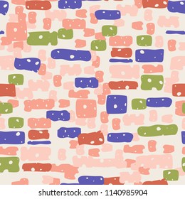 A seamless camouflage pattern made up of brick-like colored spots. 