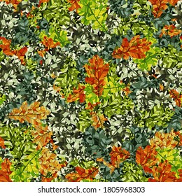 Seamless camouflage of variegated oak leaves. Orange, brown, yellow, green.