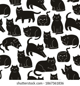 Seamless cartoon black and white hand drawn cat pattern for fabric textile or wrapping paper.  Cute cartoon vector illustration for children 