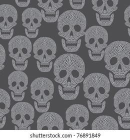 Seamless cartoon pattern with skull. Background in grey colors with skull.