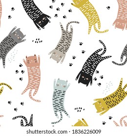 Seamless childish pattern with cute hand drawn cats and paws. Creative kids hand drawn texture for fabric, wrapping, textile, wallpaper, apparel. Vector illustration